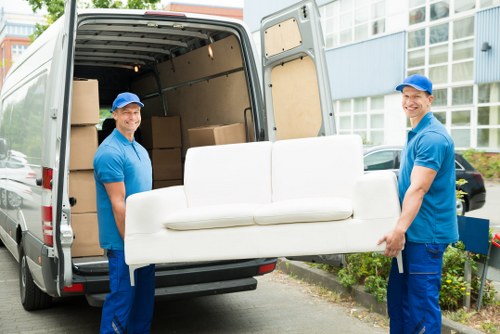 Customer booking a man and a van service with paperwork and van in the background