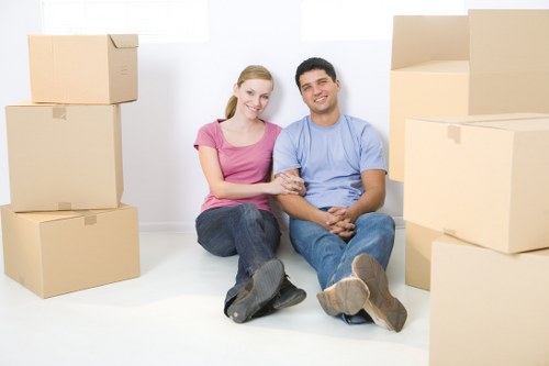 Furniture removal team planning a move in an Earls Court street