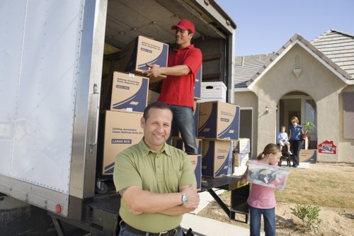 Local removal team planning a move in Earls Court with packing boxes and furniture