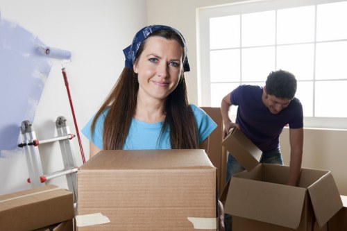 Packed boxes and furniture ready for a house move in Earls Court