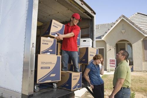 Packed household items and furniture ready for transport from an Earls Court property