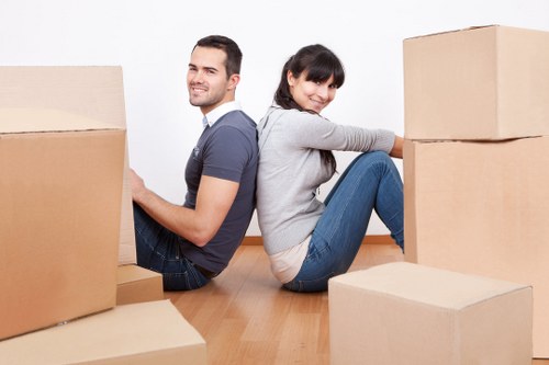 Careful handling of furniture during a flat move in Earls Court
