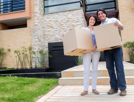 Packed moving boxes and furniture ready for a local home move