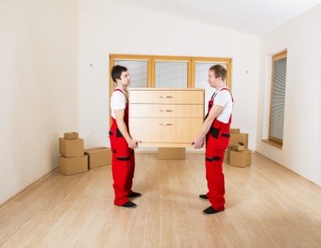 Trained moving staff using safe handling techniques in Earls Court